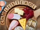 The image is a flat lay of a wooden platter with various food items arranged on it. The platter is made of wood and has the w...