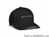 The image is of a black baseball cap with the words "PRAY ALWAYS" written in white capital letters on the front. The cap has...