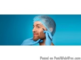 The image shows a man's face before a plastic surgery procedure. He is wearing a blue surgical cap on his head and blue glove...