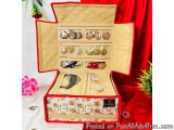 The image shows a red jewelry box with a quilted interior. The box is open, revealing the interior of the box. Inside the box...