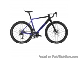 The image is of a blue and black mountain bike. The bike has a sleek design with a black frame and blue accents. It has a bla...