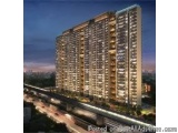 The image is a 3D rendering of a high-rise apartment building at night. The building is tall and has multiple floors, with ba...