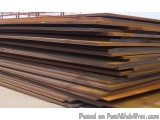 The image shows a stack of wooden planks stacked on top of each other. The planks are arranged in a horizontal manner and app...