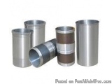 The image shows four cylindrical metal objects, which appear to be made of stainless steel. The objects are arranged in a hor...