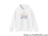 The image is of a white hoodie with a text-based design on the front. The text reads "Messy bun & getting stuff done" in a cu...