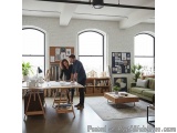 The image shows a modern living room with a large window on the left side and a large arched window on both sides. The room h...