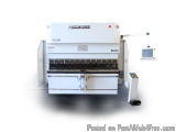 The image shows a large industrial machine, specifically an E6025, which is used for cutting and shaping metal. The machine i...