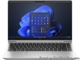 The image shows a laptop with a blue screen. The laptop is silver in color and has a black keyboard. On the screen, there is...