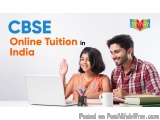 The image shows a young couple sitting at a desk with a laptop in front of them. The man is on the right side of the image, w...