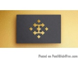 The image is a rectangular black card with a gold geometric design on it. The design is in the shape of a diamond with six po...