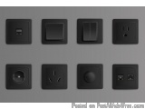 The image shows a set of nine black electrical outlets arranged in a grid-like pattern on a gray background. The outlets are...