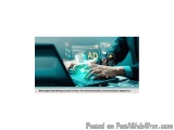 The image shows a person's hands typing on a laptop keyboard. The laptop screen displays the word "AD" in bold letters, surro...