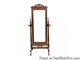 The image is of a wooden floor-standing mirror with a rectangular frame. The frame is made of dark wood and has an ornate des...
