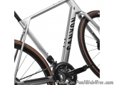 The image is a close-up of the frame of a bicycle. The frame is made of aluminum and has a sleek, modern design. It has a sil...