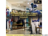The image shows the interior of a clothing store called M&M Jewel Gurgaon. The store has a modern and luxurious design with a...