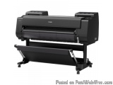 The image shows a large format printer, specifically a Canon brand, on a white background. The printer is black in color and...