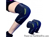 The image shows a person's lower body from the waist down, wearing a black knee brace with a blue and yellow striped pattern....