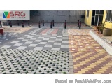The image shows a set of colorful pavement tiles arranged in a grid-like pattern. The tiles are made up of different shades o...