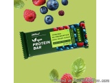 The image is an advertisement for a protein bar. The bar is green in color and has a label on it that reads "AltaHair Protein...