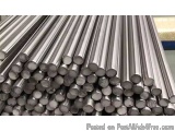 The image shows a stack of stainless steel rods. The rods are arranged in a neat and orderly manner, with each rod slightly o...