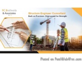 The image is an advertisement for a company called PC Bodiwala & Associates. It features a construction site with a crane in...