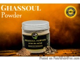 The image is an advertisement for a product called "Ghassoul Powder". The background is a gradient of orange and yellow, with...