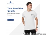 The image shows a young man wearing a white t-shirt with a black logo on the front. He is standing in front of a white backgr...