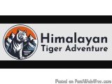 The image is a logo for Himalayan Tiger Adventure. It has a white background with a black border. In the center of the logo,...