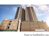 The image shows a 3D rendering of a tall, modern apartment building. The building is made up of multiple floors and has multi...