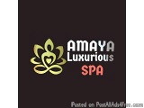 The image is a logo for a spa called Amaya Luxurious Spa. The logo is a combination of the word "Amaya" in a modern, sans-ser...