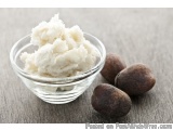 The image shows a small glass bowl filled with a creamy white substance, which appears to be a type of ice cream or sorbet. T...