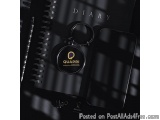 The image is a black and white photograph of a diary with a keychain attached to it. The keychain has the word "Diary" writte...