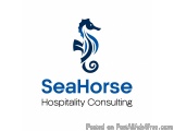 The image is a logo for SeaHorse Hospitality Consulting. It is a simple design with a blue color scheme. In the center of the...