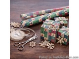 The image shows a group of small gift boxes wrapped in colorful wrapping paper with a geometric pattern. The boxes are arrang...
