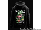 The image is of a black hoodie with a graphic design on the front. The design features a pink flamingo standing on a branch w...