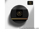 The image is a black circular box with a gold logo in the center. The logo is a stylized letter "Q" with a crown on top, repr...
