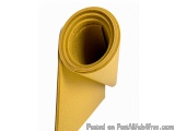 The image shows a roll of gold-colored paper or cardboard. The roll is rolled up and appears to be new and unused. The paper...