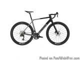 The image is of a black and silver mountain bike. The bike has a sleek design with a black frame and silver accents. It has a...