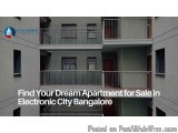 The image shows an apartment building in Electronic City Bangalore, India. The building is made of concrete and has multiple...