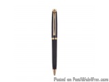 The image is of a black ballpoint pen with a gold-colored cap. The pen has a sleek and modern design with a curved body and a...