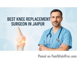 The image shows a man wearing a blue scrub suit and a stethoscope around his neck. He is standing with his arms crossed and i...