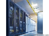 The image shows a row of servers in a data center. The servers are arranged in a neat and orderly manner, with rows of them f...