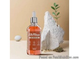 The image shows a bottle of AltAhar Glow with Every Sip. The bottle is orange in color and has a white spray nozzle. The labe...