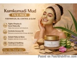 The image is an advertisement for a face pack called Kumkumadi Mud. The background of the image is a woman with a face mask o...