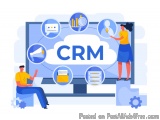 The image is an illustration of a computer monitor with the word "CRM" on it. The monitor is surrounded by various icons repr...