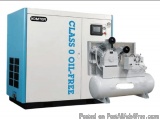 The image shows a Komter Class O Oil-Free air compressor. It is a large industrial machine with a blue and white exterior and...