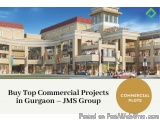 The image is a 3D rendering of a commercial building in Gurgaon, India. The building is a two-story structure with a red roof...