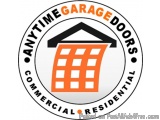 The image is a circular logo for Anytime Garage Doors Commercial Residential. The logo is black and white and has a white bac...