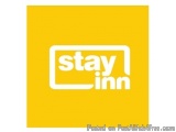 The image is a square-shaped logo with a bright yellow background. In the center of the logo, there is a white text that read...