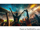 The image shows a large crowd of people in a stadium with their hands raised in the air. The person in the center of the imag...